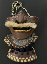 Japanese Samurai Menpo or Me no shita ho facial armour with brown lacquer finish and bristle