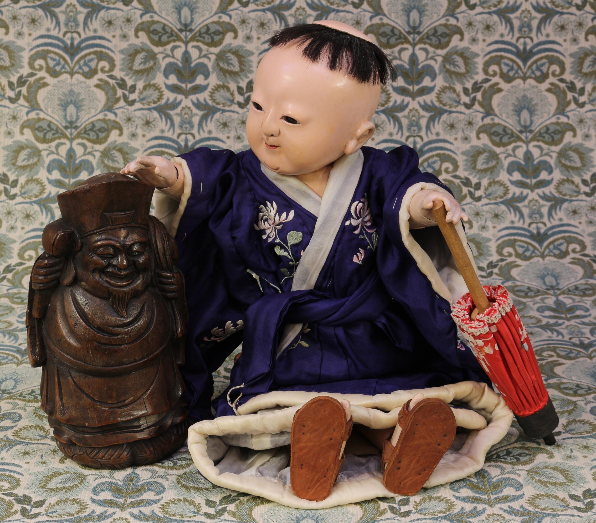 A Japanese gofun Ichimatsu traditional doll, as a Boy, the gofun head with inset eyes and painted