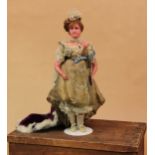 A late 19th century poured wax shoulder head portrait doll of Princess Mary of Teck, attributed to