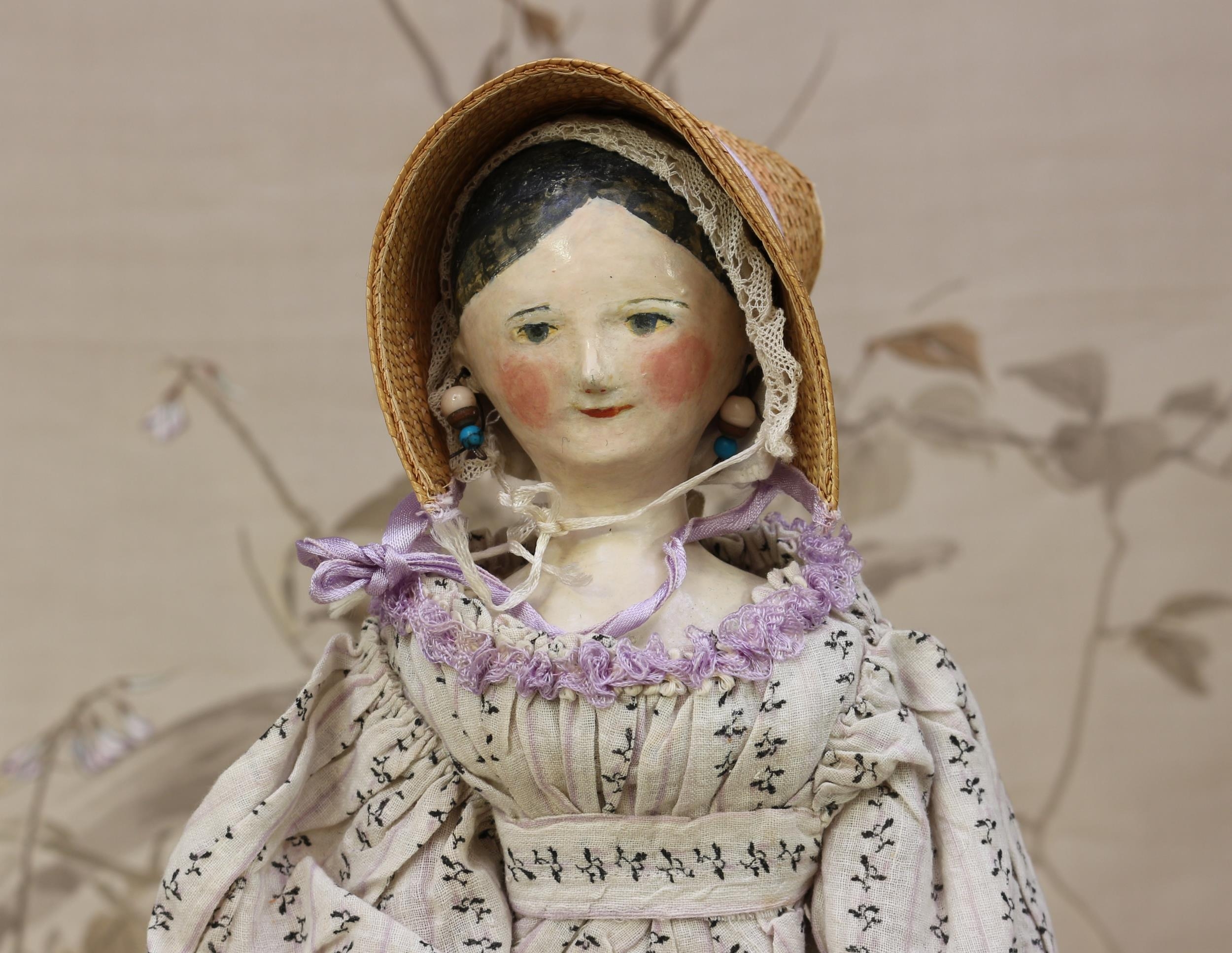 A mid 19th century carved and painted wooden doll, the carved and painted head with painted features - Image 2 of 2