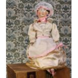 A painted painted papier-mâché shoulder head doll, the painted papier-mâché head with black