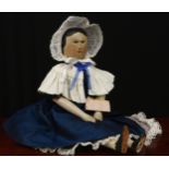 A mid 19th century Grödnertal or 'Dutch' peg doll, the carved and painted head with painted features