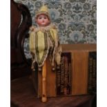 An Armand & Marseille (Germany) bisque shoulder head musical marotte doll, the bisque head with