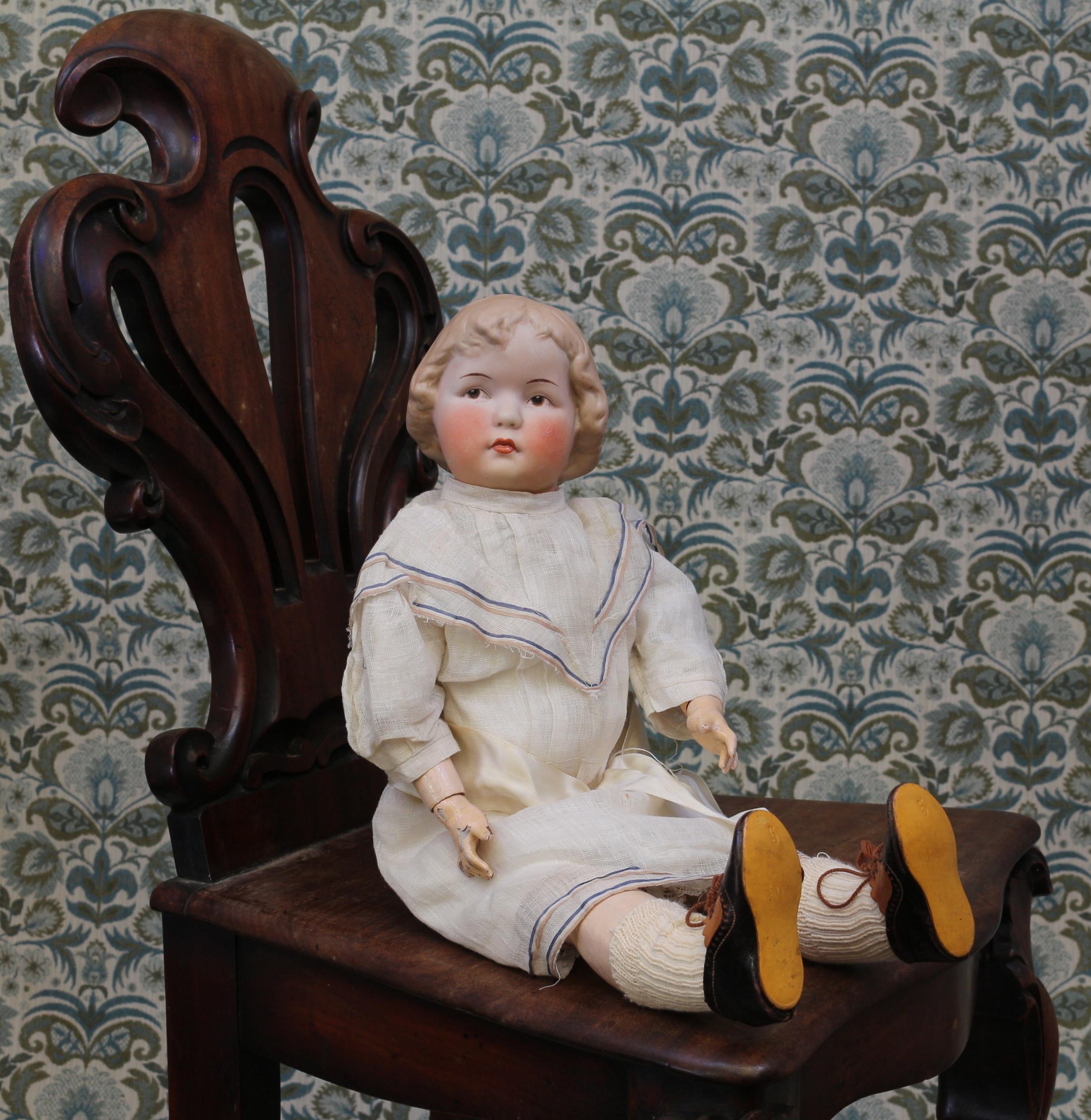 A German bisque head and painted composition bodied 'Coquette' type doll, unmarked but attributed to