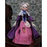 A reproduction 'Queen Anne' style carved and painted wooden artist doll, the carved and painted head