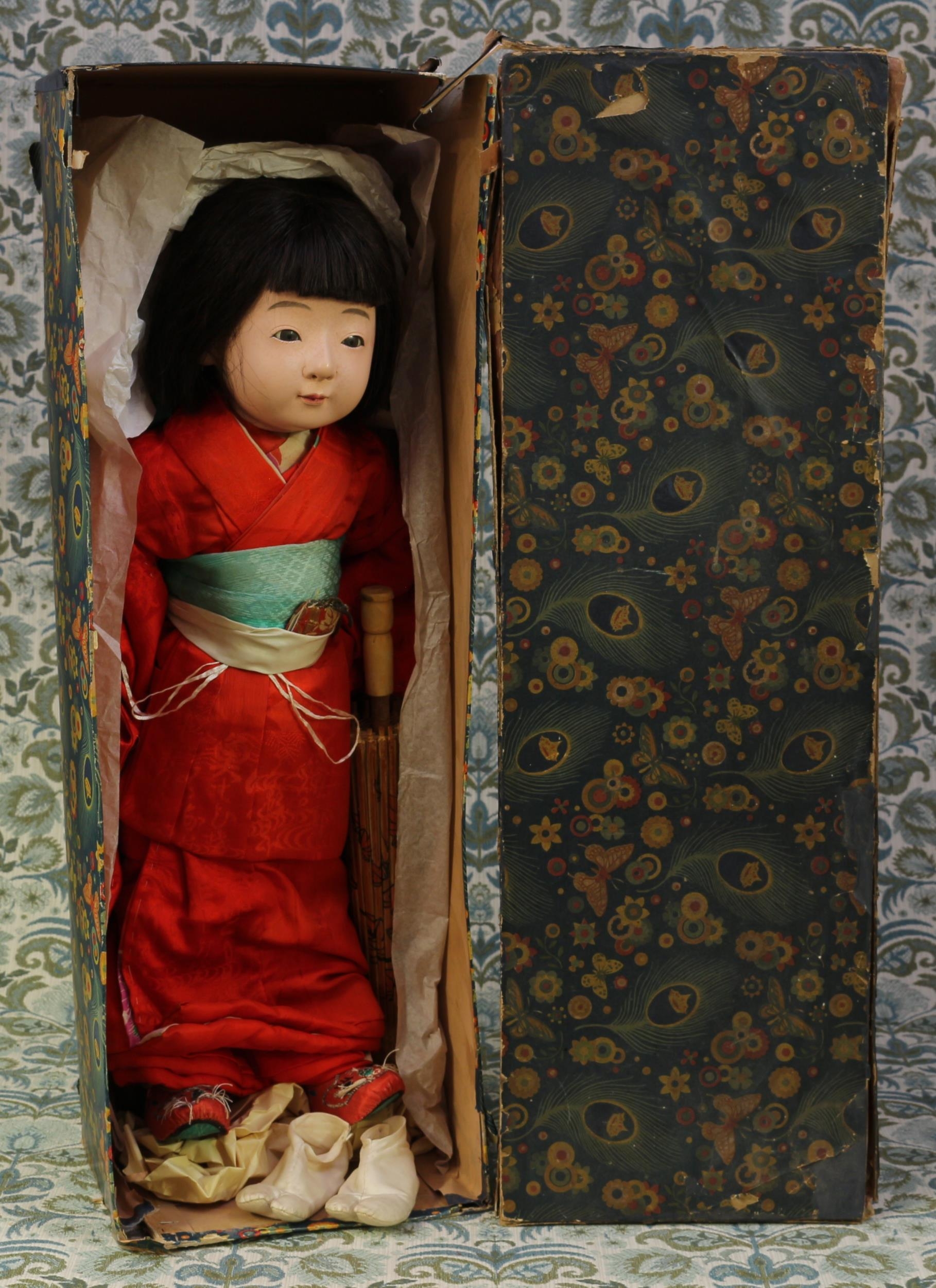 A 1930's Japanese gofun Ichimatsu traditional doll, the gofun head with inset eyes and painted