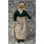 A 19th century Grödnertal or 'Dutch' peg doll, the carved and painted head with painted features