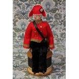 Folk Art - a carved and painted wooden doll, in uniform, the carved and painted wooden head with