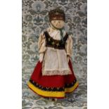 A 19th century Grödnertal or 'Dutch' peg doll, the carved and painted head with painted features