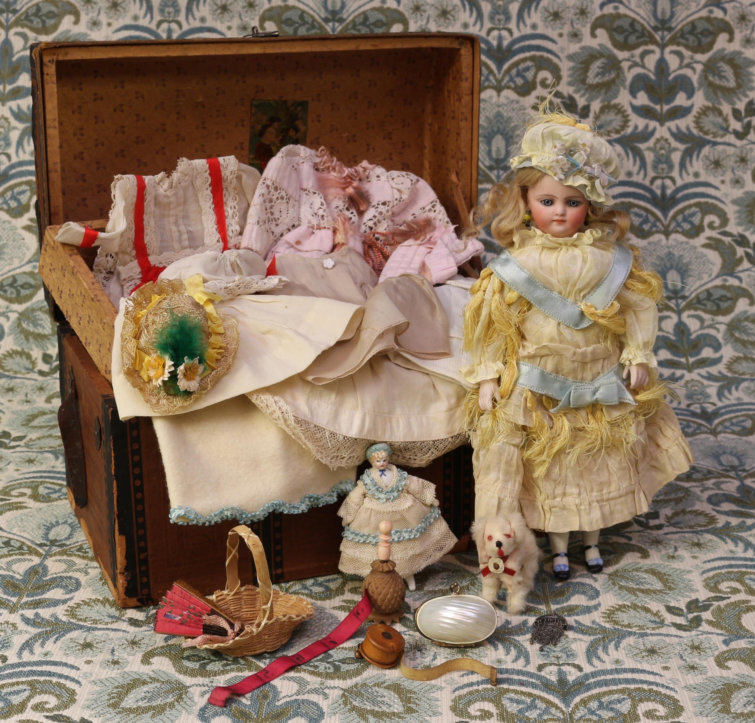 A late 19th century bisque shoulder and bisque head doll, of small proportions, the bisque head