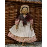 A 19th century Grödnertal or 'Dutch' peg doll, the carved and painted head with painted features