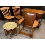 An metamorphic oak armchair / side-table, c.1950, 80cm high x 71cm wide x 57cm (as a chair); a