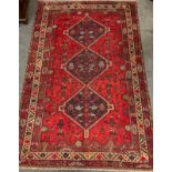 A South West Persian Shiraz carpet / rug, hand-knotted with triple diamond medallions within a field