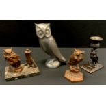 A Bronze candlestick modelled as a owl, signed ' Barrie', c1930's; Copper lighter as a owl stoop