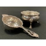 A George III silver table salt, marks worn, possibly London 1771; with associated tea strainer