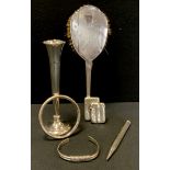 A Victorian silver vesta case, London 1883; another Chester 1909; silver backed brush; bud vase;