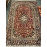 A central Persian Kashan carpet, hand-knotted, 330cm x 200cm