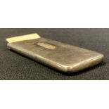 An Edwardian silver patent visiting card case of plain rectangular form, sliding thumb piece