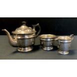 A George VI silver three piece tea set, teapot, sugar bowl and milk jug, Viners Sheffield , 1939,