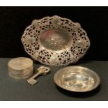 A silver pin dish, 8cm diameter, 1.48ozt; Indian 800 silver oval dish, 2.0ozt; white metal pill