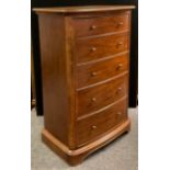 A Willis and Gambier Tallboy chest of drawers, over-sailing top, slightly bow-front, five
