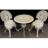 A contemporary metal garden bistro set, painted white, comprised of small circular tripod table, and