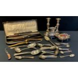 A stag horn handled stainless steel three piece carving set, cased; pair of candlesticks, milk jug