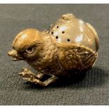 A late Victorian/early Edwardian novelty ink/pounce pot as a chick, supporting a rotating vessel,