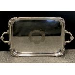 A Walker & Hall rounded rectangular silver plated tray, cast floral corners and handles, 72cm x 43cm