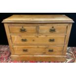 A Victorian pine chest of drawers, two short over two long drawers, Art Nouveau style brass handles,