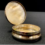 A silver coloured metal and mother of pearl snuff box, the hinged cover carved, the sleeping man