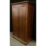 A Willis and Gambier mahogany wardrobe, over-sailing cornice, above a pair of panelled doors, single