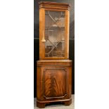 A George III style reproduction mahogany corner cabinet, dentil cornice, astral-glazed door to top