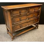 A mid 20th century oak chest of drawers, two short over two long drawers, barley twist supports,