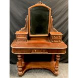 A Victorian mahogany dressing table, arched mirror back, drawered pillars, single frieze draw,