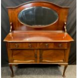 An early 20th century mirror back mahogany sideboard, arched top with oval mirror, pair of drawers