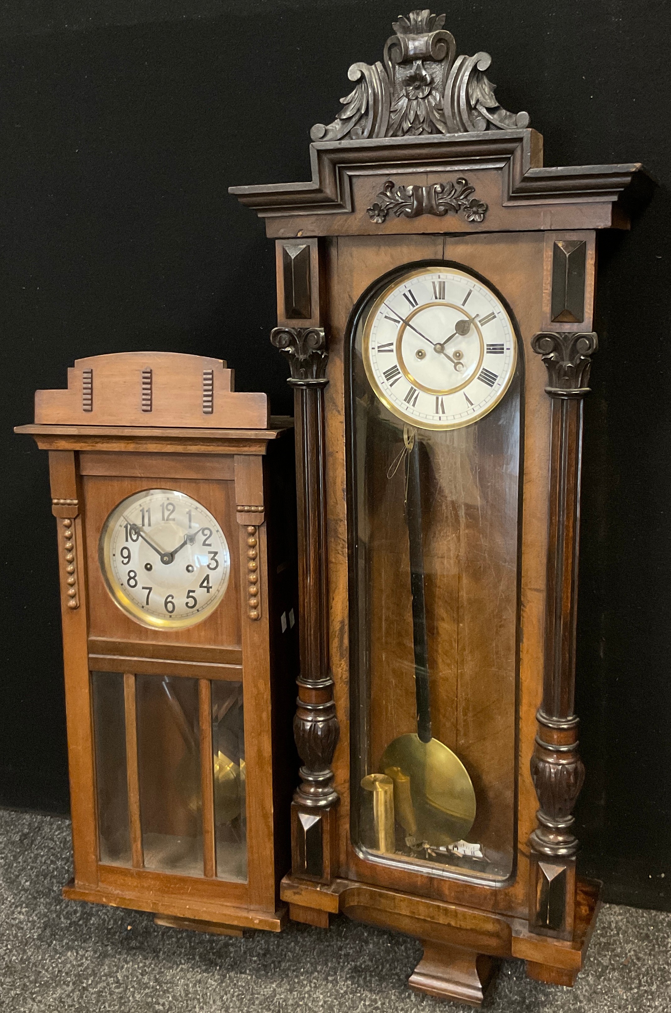 A 19th century Vienna wall clock, white dial, Bold Roman numerals, 116cm high, 42.5cm wide;