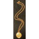 A 9ct gold St Christopher pendant necklace, 12.8g gross