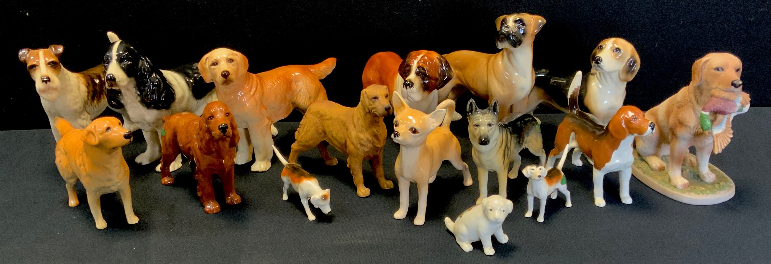 A Sylvac model of a chihuahua, 15cm; a Beswick model of a Labrador, spaniel, two smaller hunting