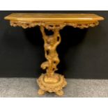 An Italian style reproduction giltwood console table, figural putto support, quatrefoil base with