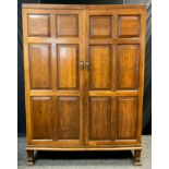 A Victorian oak double wardrobe, full length six-panel doors, tapered square feet, 182.5cm high x