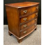 A George III style mahogany bow-front chest of drawers, by Burton Reproductions Ltd., four long