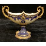 A porcelain twin-handle navette-shaped urn, in the manner of Coalport, 19cm high, 25cm wide, printed