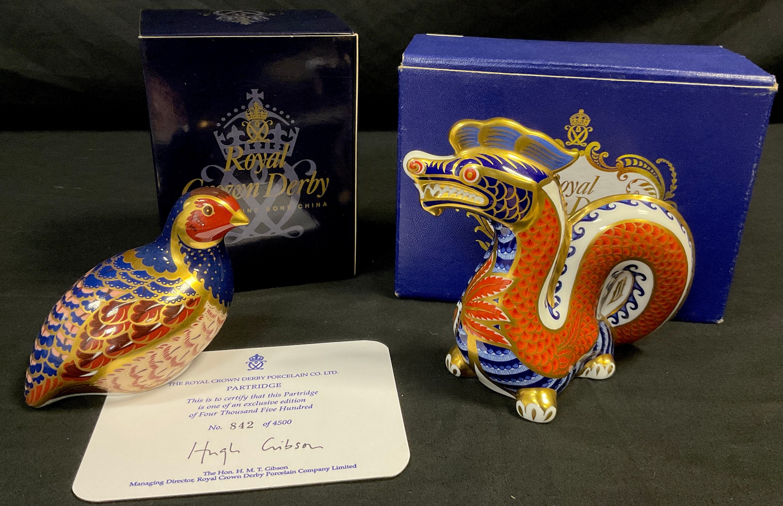 A Royal Crown Derby limited edition Paperweight Partridge, 842/4500, gold stopper; another Dragon,