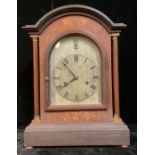 A bracket type mantel clock, arched silvered dial, Roman numerals, twin winding holes, 42.5cm