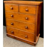 A Victorian mahogany chest of drawers, two short over three long graduated drawers, turned