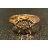 A continental 15ct gold diamond ring, set with central round brilliant cut diamond between rose