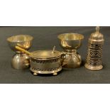 two silver double egg cups; a silver mustard; a silver pepperette (4)