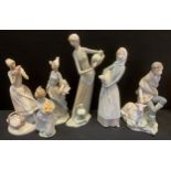 A LLadro pottery figure, Girl with Lamb; others water carriers, Alpine boy, fruit girl etc,