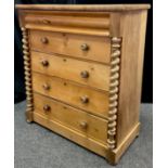 A Victorian, Scottish, Pine chest of drawers, concealed drawer to top frieze, above four long
